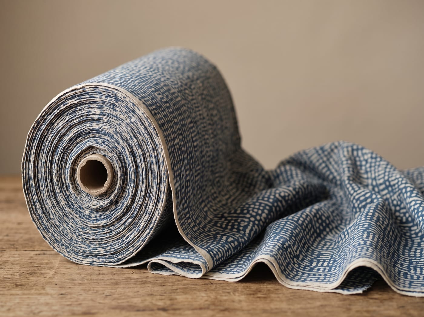 Printed cotton with a small two-colour indigo and ecru geometric pattern