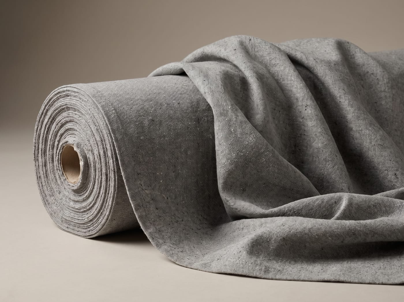 Recycled cotton canvas in a heathered mid grey flecked with recycled fibre